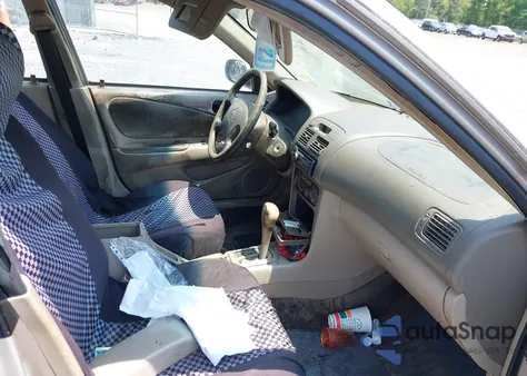 2002 Toyota Corolla Le z USA, uszkodzony, nr VIN 2T1BR12EX2C577933